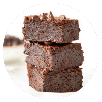 Brownies with coconut flour in a stack.