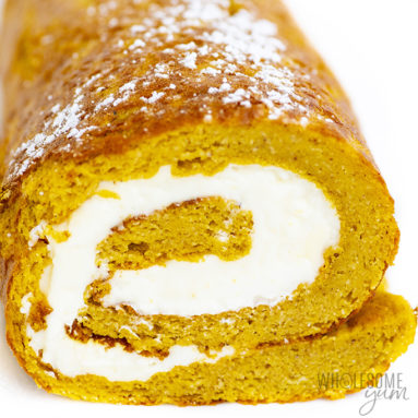 Side view of keto pumpkin roll with powdered monk fruit sweetener on top