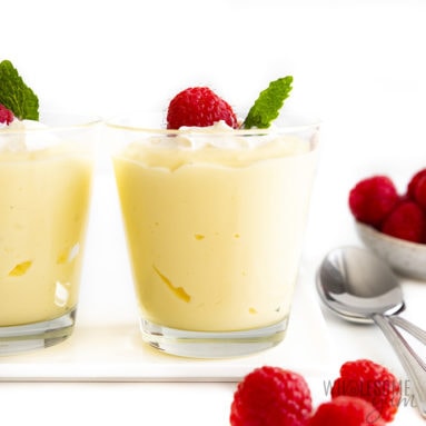 Sugar-free vanilla pudding in a cup with raspberries