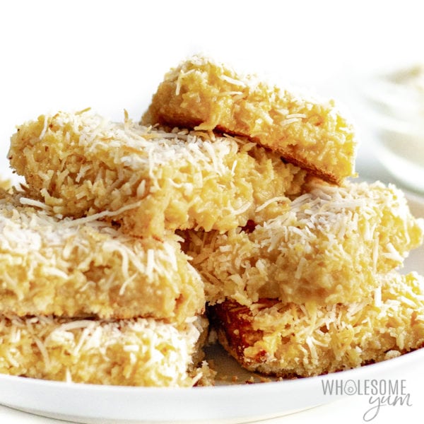 Coconut bars stacked on a plate