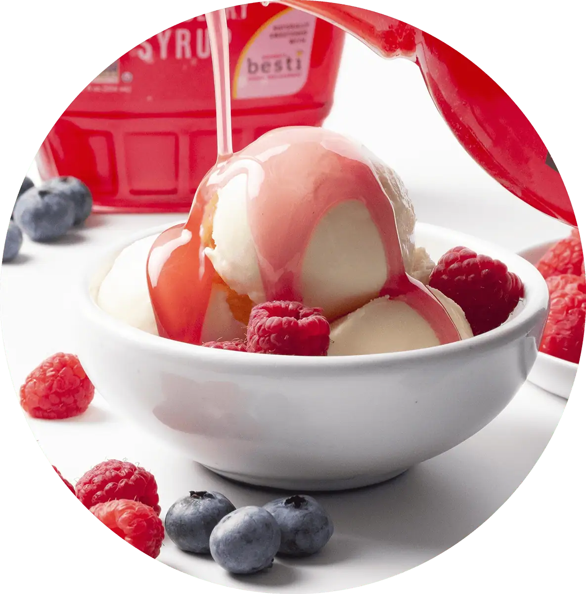 Wholesome Yum Sugar Free Raspberry Syrup Pouring Over Ice Cream.