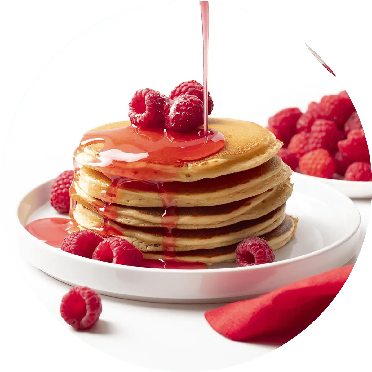 Wholesome Yum Sugar Free Raspberry Syrup Pouring Over Pancakes.