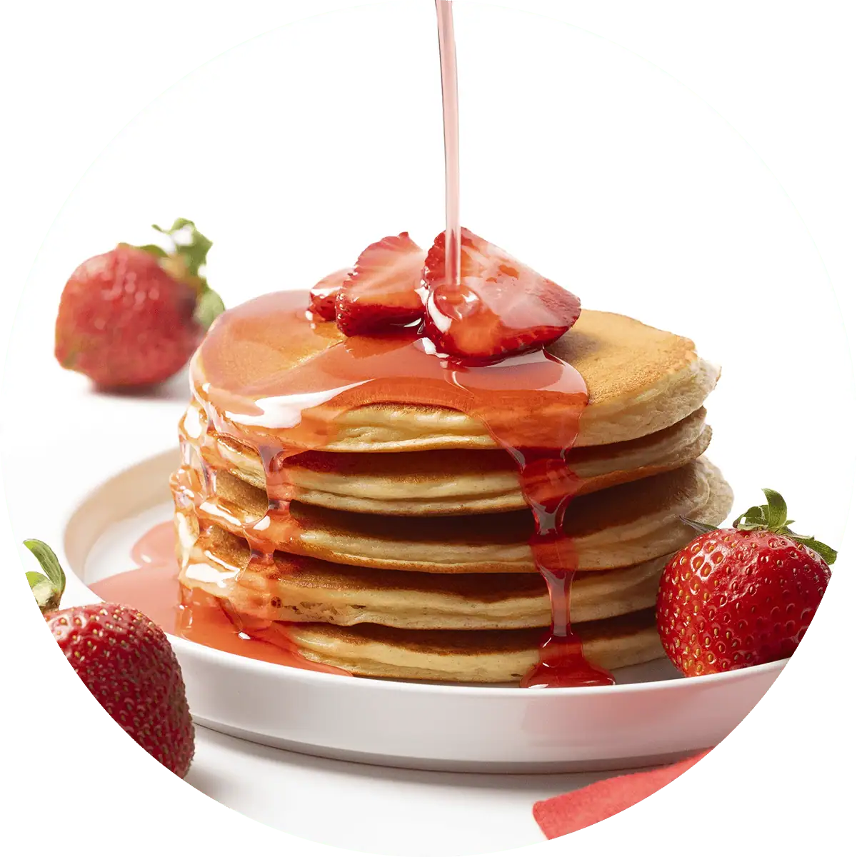 Wholesome Yum Sugar Free Strawberry Syrup Pouring Over Pancakes.
