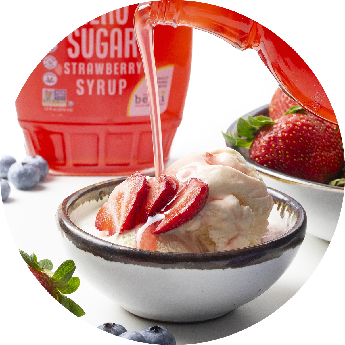 Wholesome Yum Sugar Free Strawberry Syrup Pouring Over Ice Cream.