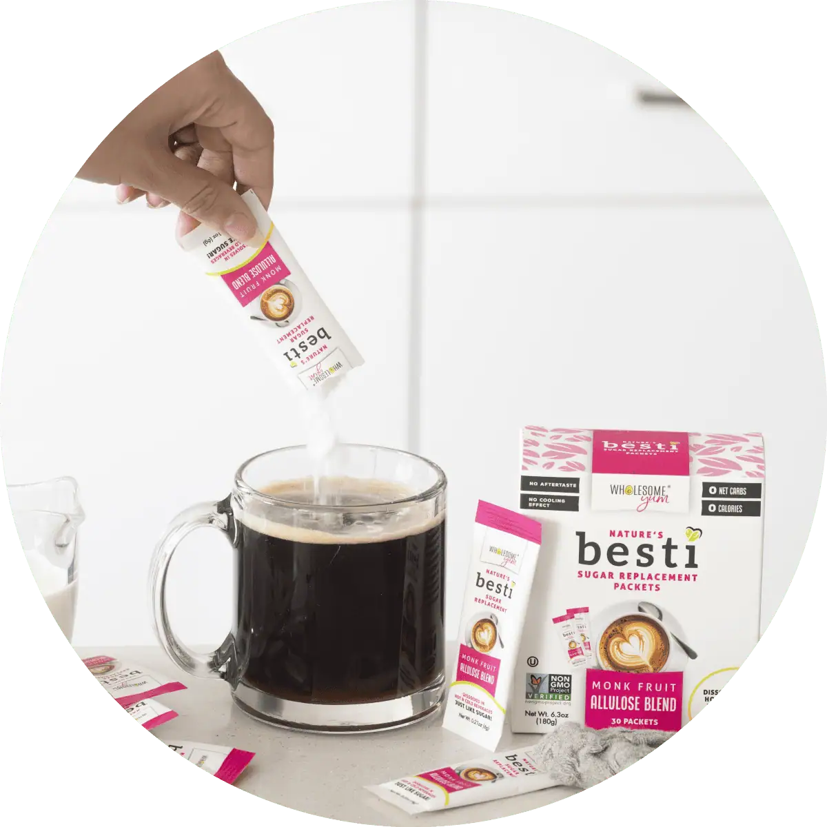 Wholesome Yum Besti sweetener packets pouring into coffee.